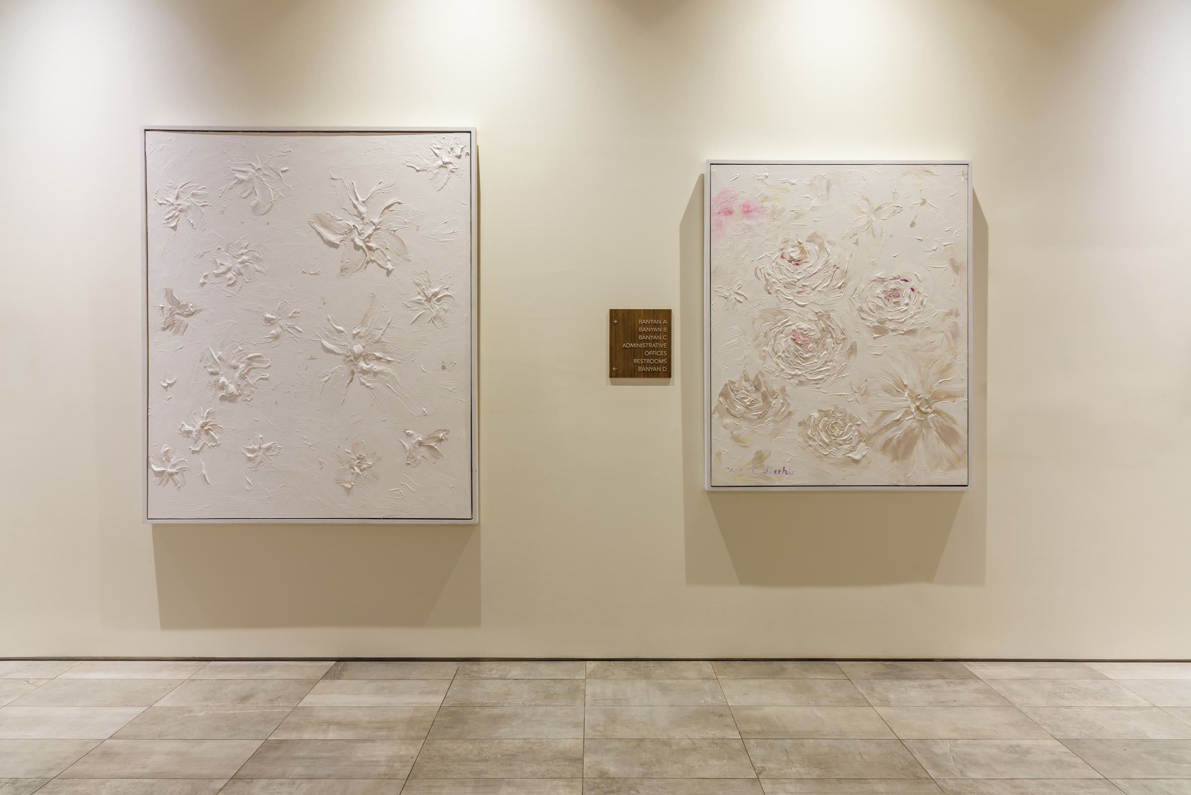 Two White Series paintings installed in a gallery